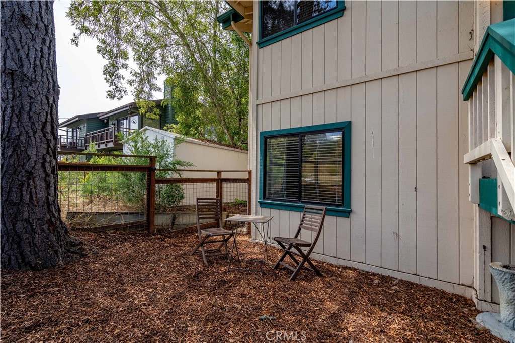 2755 Taft Place Cambria, CA 93428 - Photo 23 of 43 a backyard of a house with table and chairs
