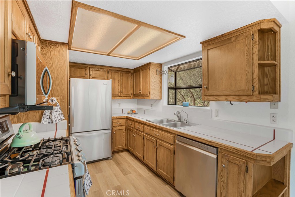 2755 Taft Place Cambria, CA 93428 - Photo 5 of 43 a kitchen with a sink appliances and cabinets