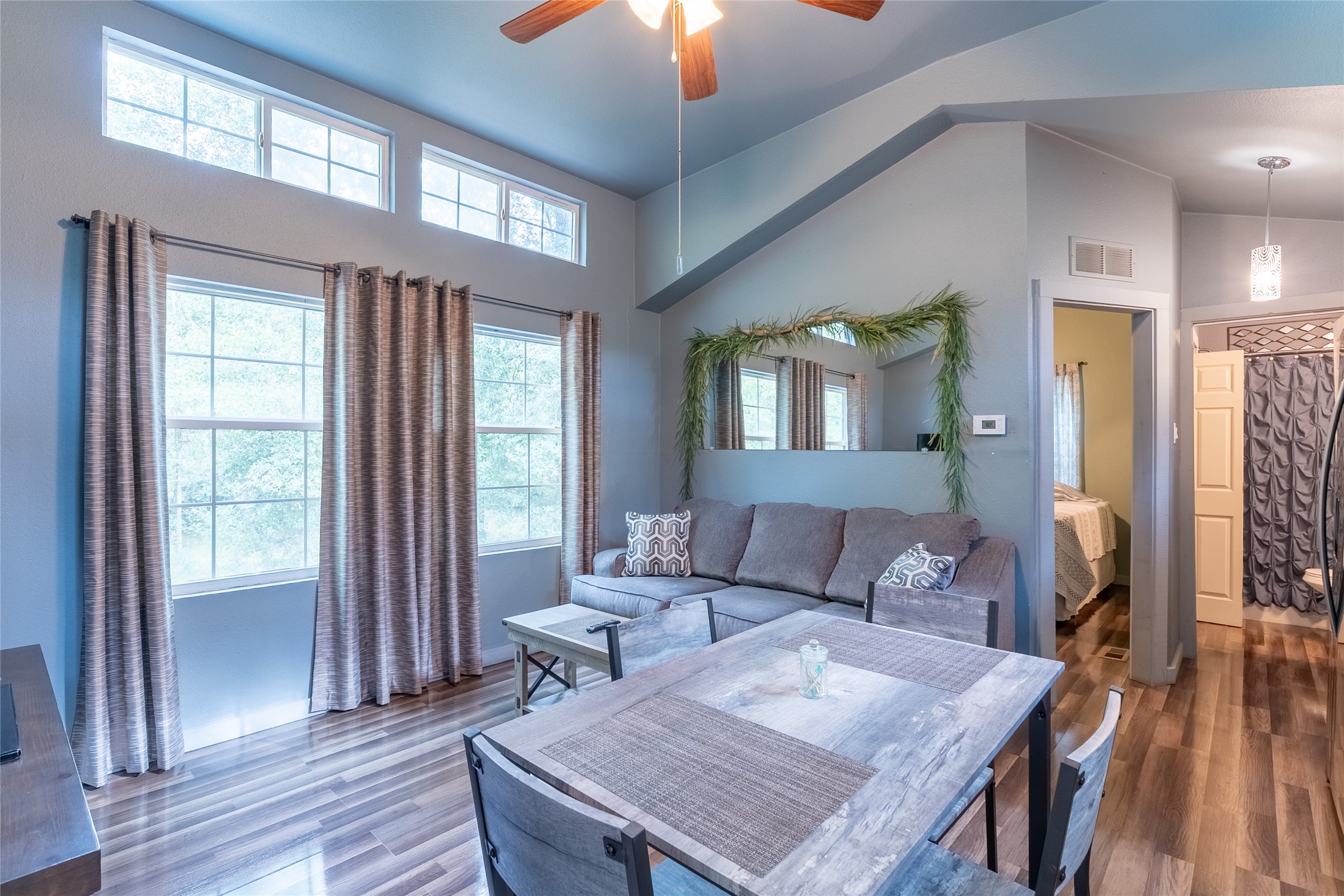 215 Center Street Cleveland, TX 77327 - Photo 12 of 38 a living room with furniture and wooden floor