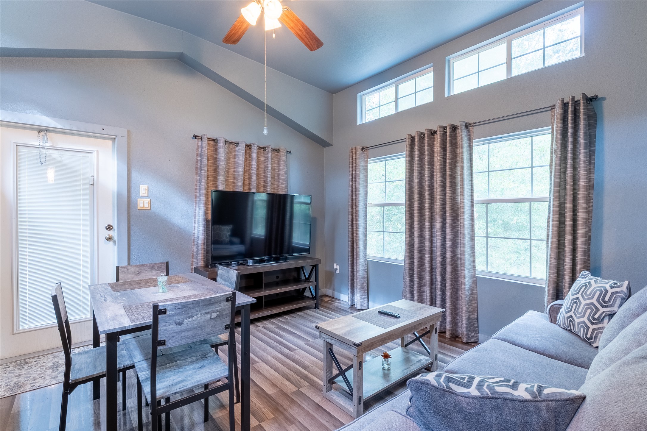215 Center Street Cleveland, TX 77327 - Photo 13 of 38 a living room with furniture and a flat screen tv