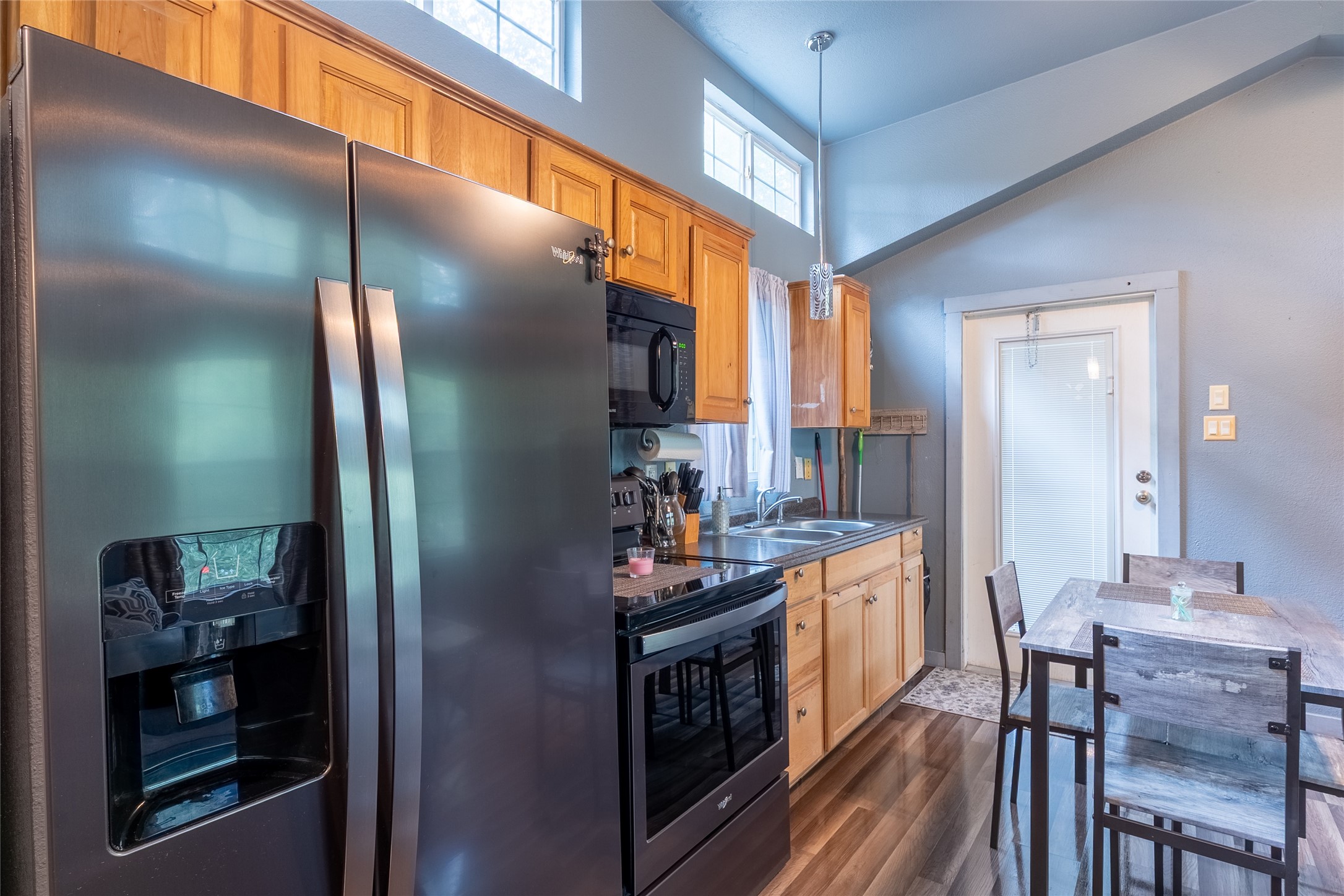 215 Center Street Cleveland, TX 77327 - Photo 15 of 38 a kitchen with stainless steel appliances granite countertop a refrigerator and a stove