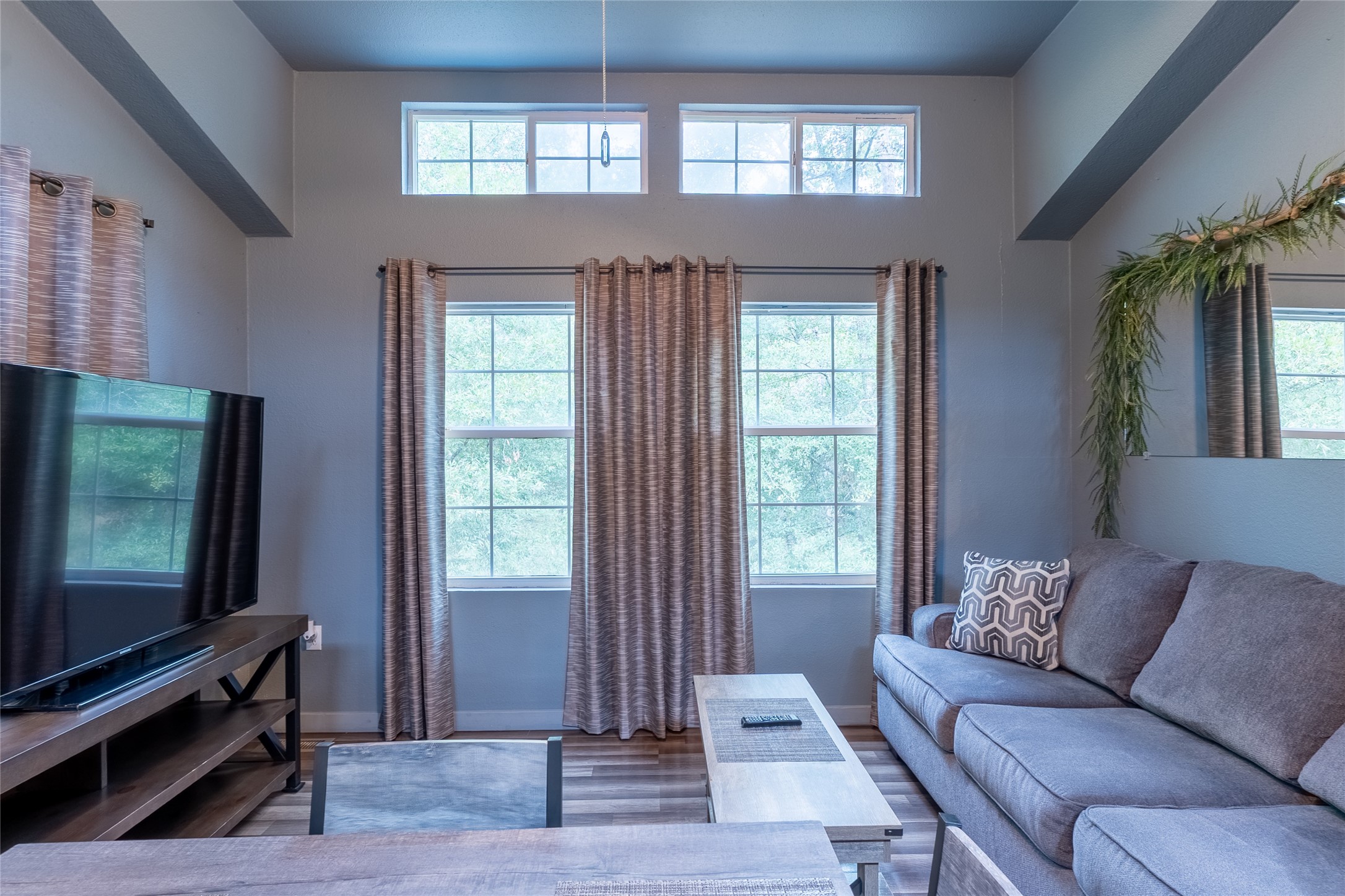 215 Center Street Cleveland, TX 77327 - Photo 16 of 38 a living room with furniture and a flat screen tv