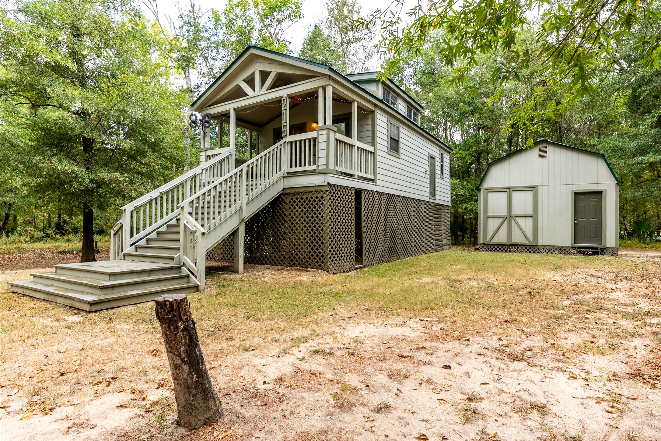 215 Center Street Cleveland, TX 77327 - Photo 2 of 38 a front view of a house with a yard and garage