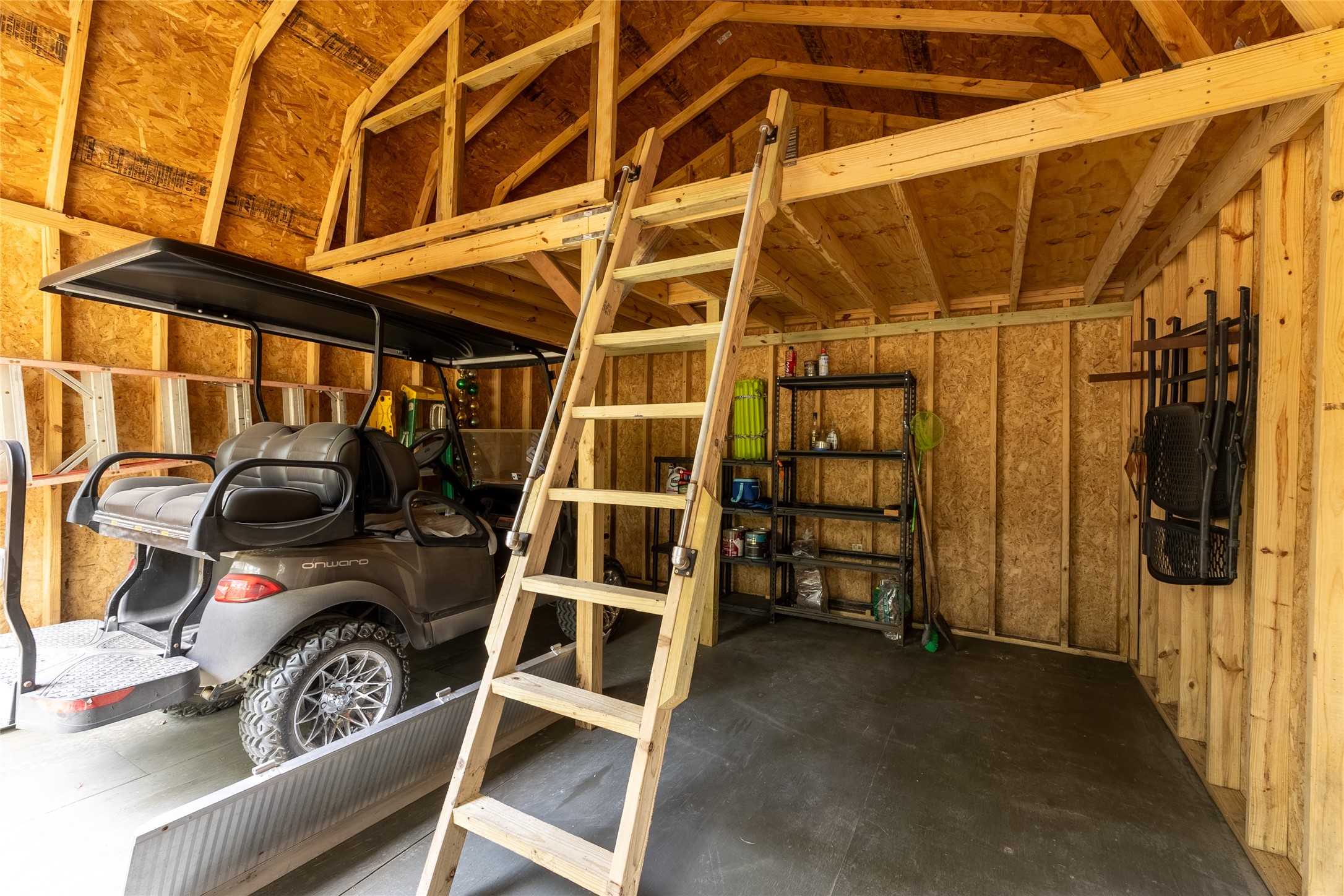 215 Center Street Cleveland, TX 77327 - Photo 21 of 38 a view of walk in closet with clothes and shoes