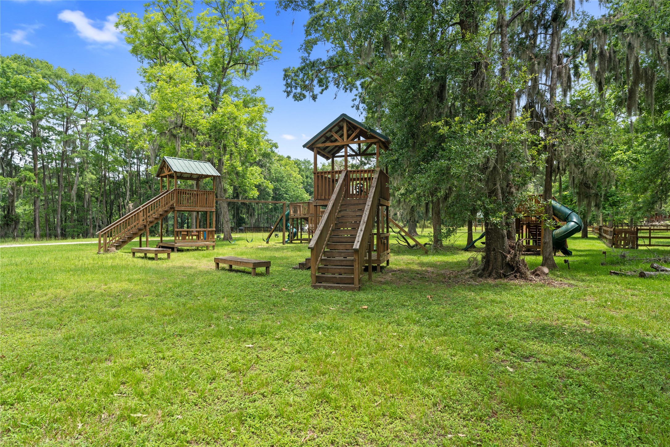 215 Center Street Cleveland, TX 77327 - Photo 24 of 38 a view of a park with a slide