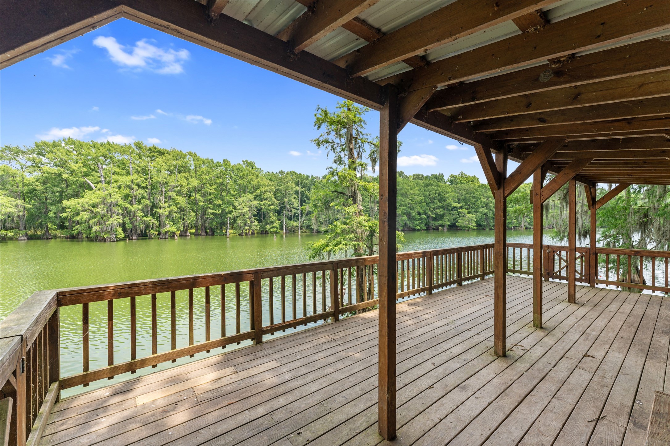 215 Center Street Cleveland, TX 77327 - Photo 27 of 38 a view of balcony with wooden floor and outdoor space