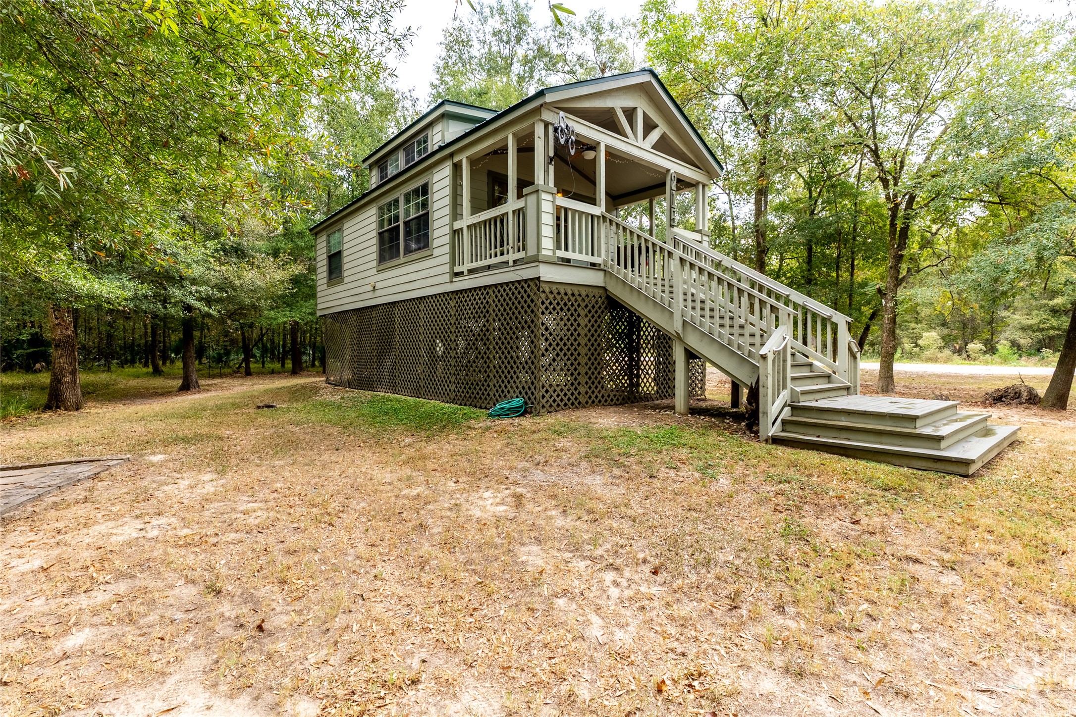 215 Center Street Cleveland, TX 77327 - Photo 3 of 38 a house with trees in the background