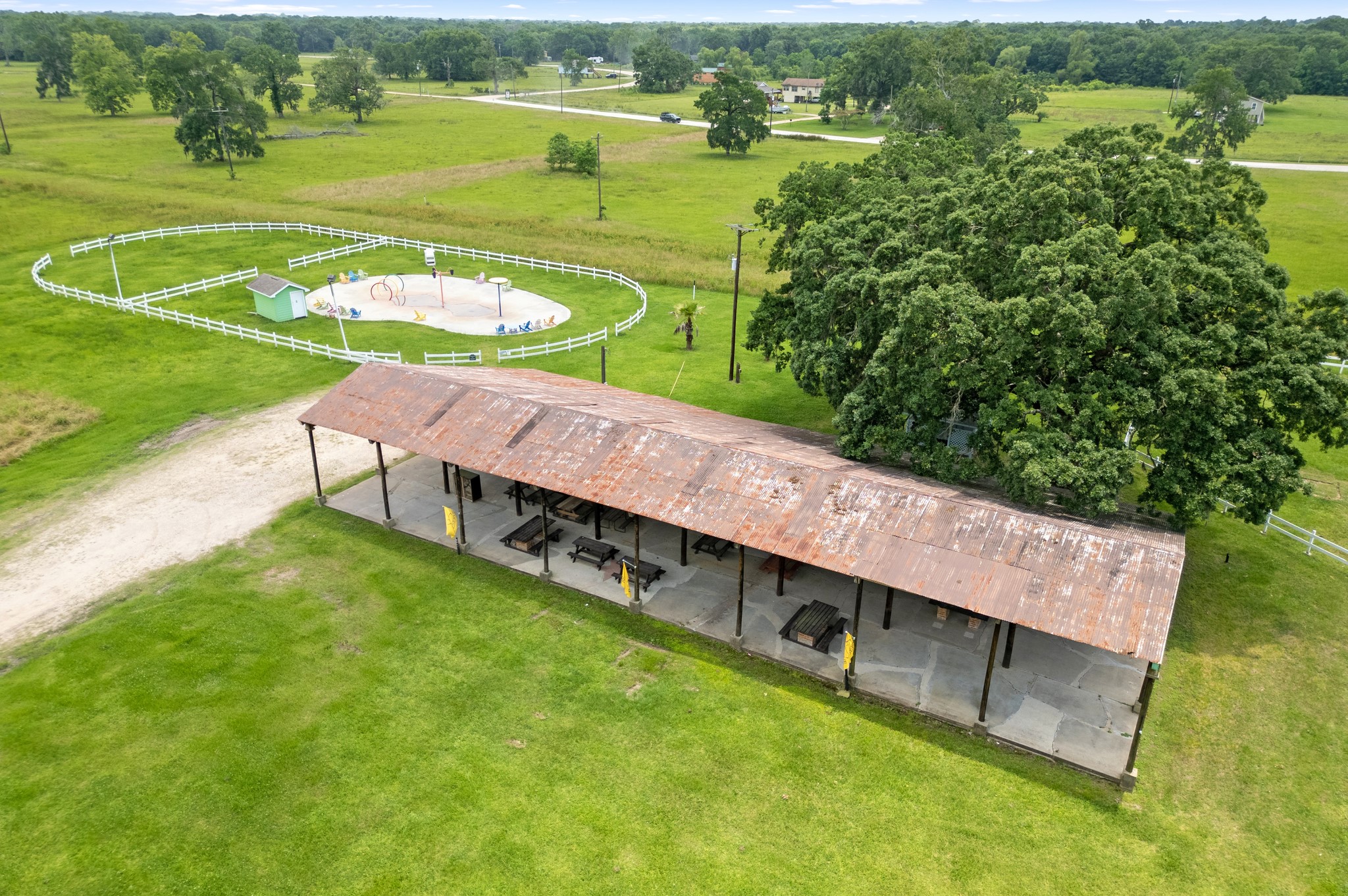 215 Center Street Cleveland, TX 77327 - Photo 33 of 38 a view of a swimming pool with a lake view