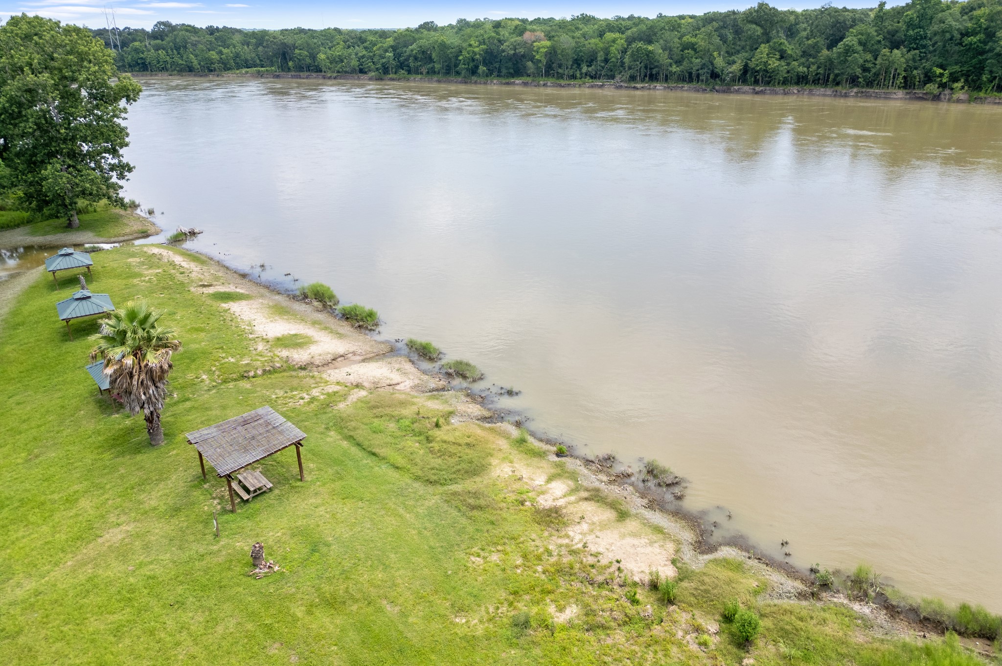 215 Center Street Cleveland, TX 77327 - Photo 34 of 38 a view of a lake with a mountain in the background and lake view