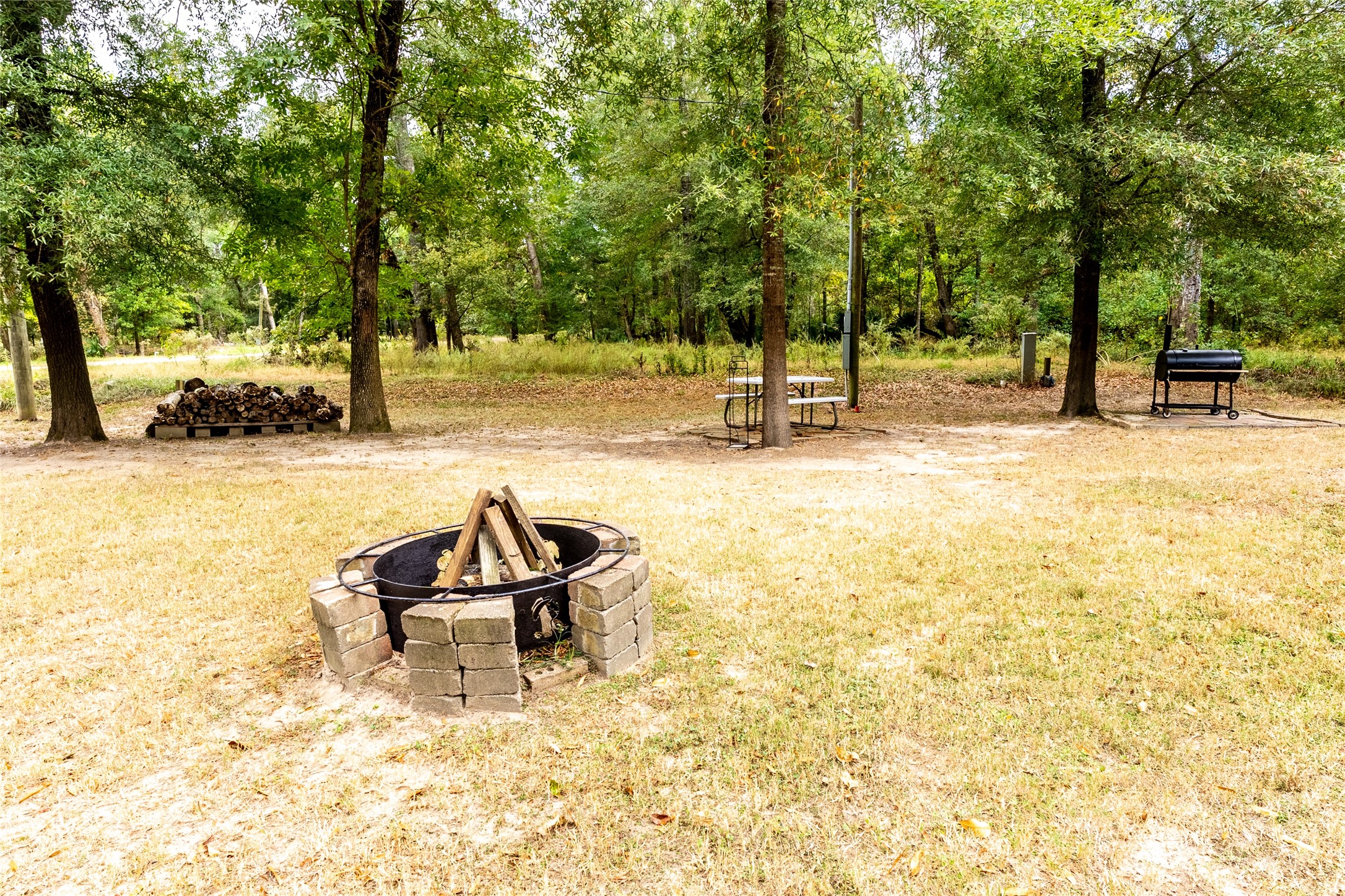 215 Center Street Cleveland, TX 77327 - Photo 4 of 38 a swimming pool with outdoor seating and yard
