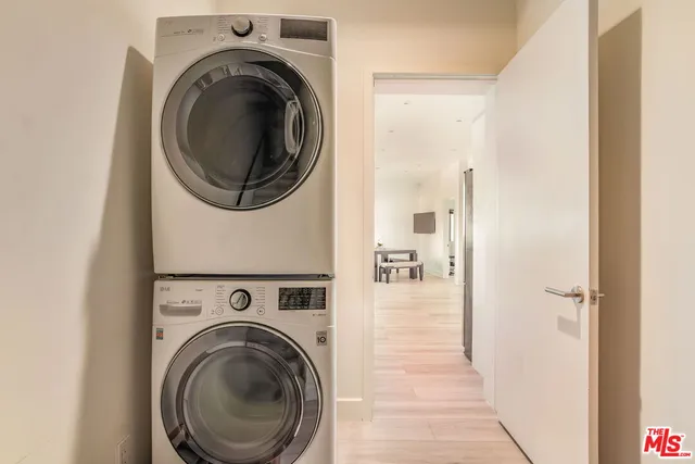 a view of a hallway with washer and dryer