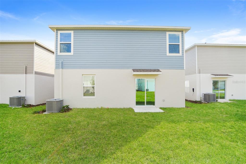 2708 Lookout Rdg Road Haines City, FL 33844 - Photo 15 of 15 a view of backyard with large windows
