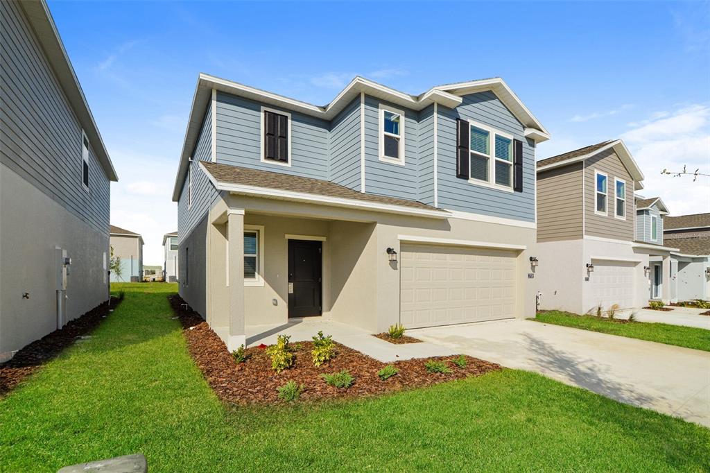 2708 Lookout Rdg Road Haines City, FL 33844 - Photo 2 of 15 a front view of a house with a yard