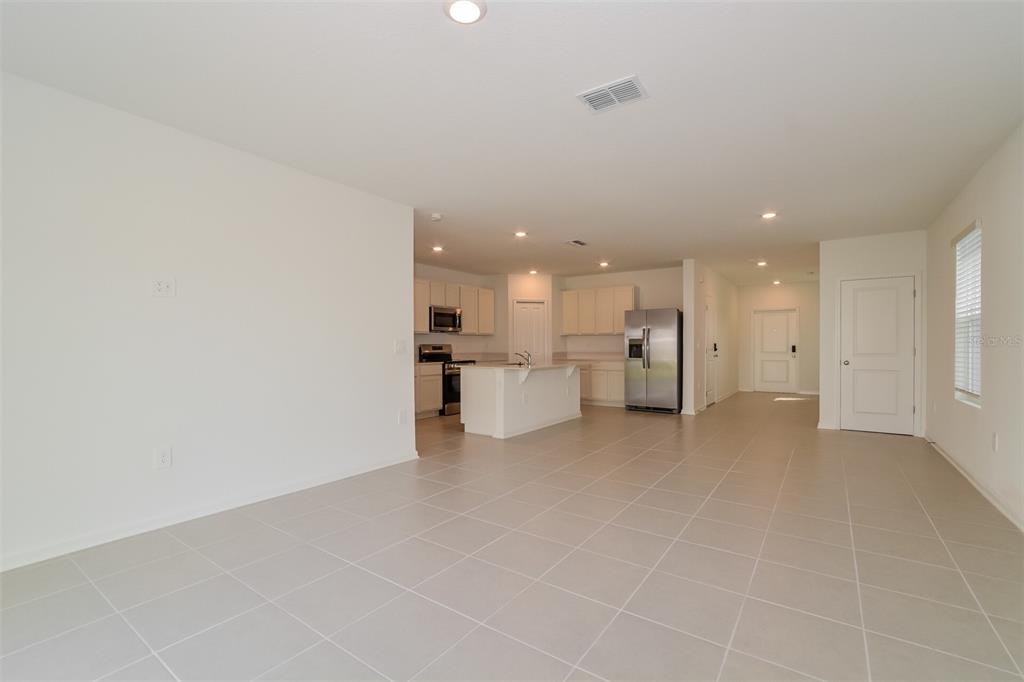 2708 Lookout Rdg Road Haines City, FL 33844 - Photo 8 of 15 a view of a kitchen with refrigerator and a sink