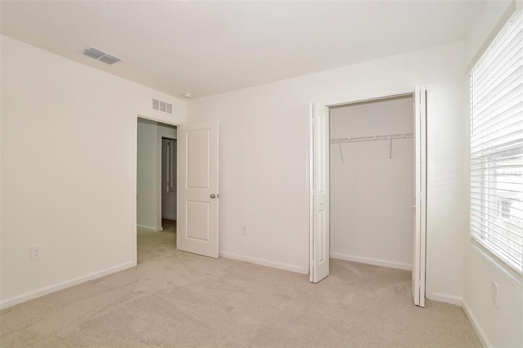 2708 Lookout Rdg Road Haines City, FL 33844 - Photo 10 of 15 an empty room with windows and closet