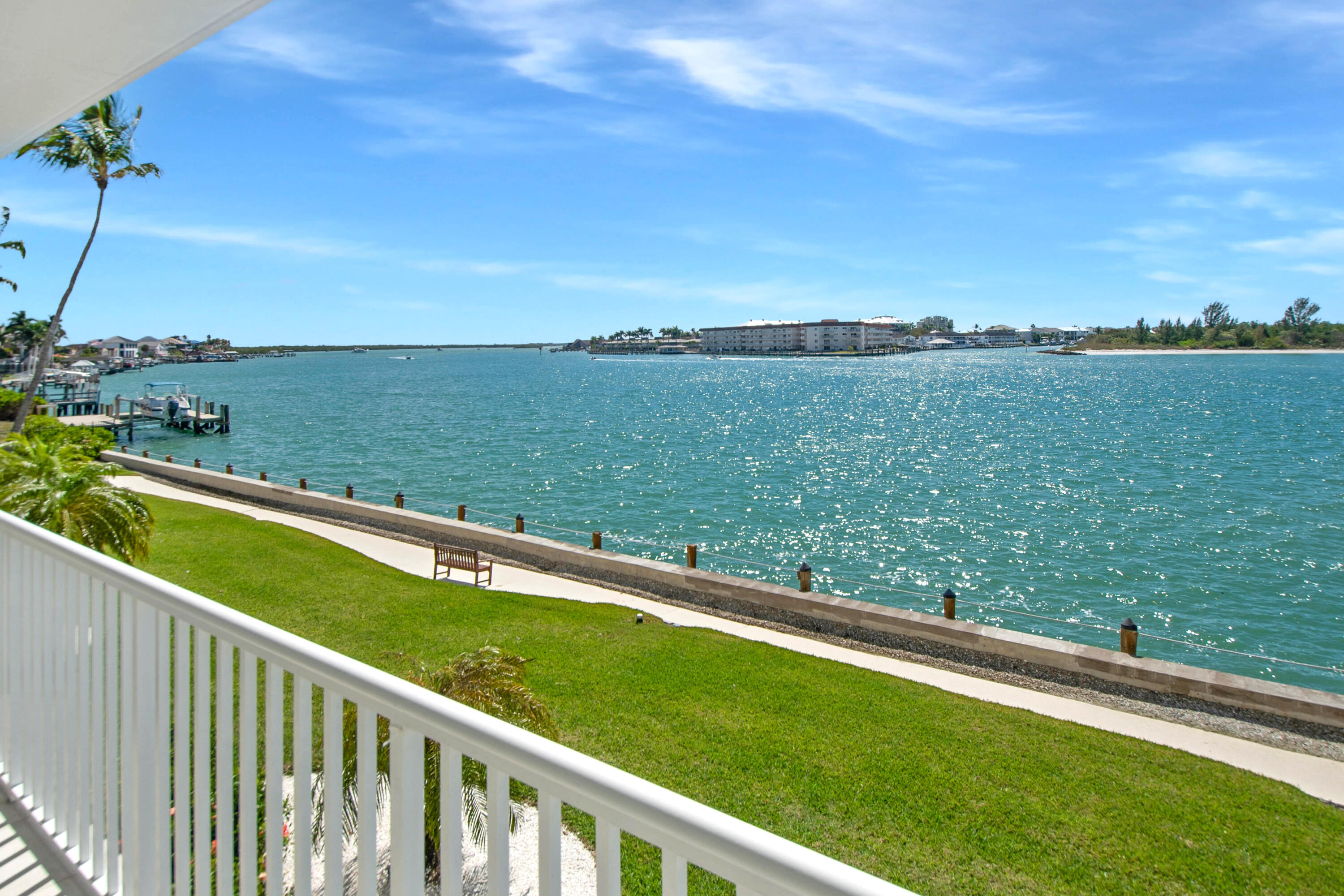 60 West Pelican Street, Unit 206 Naples, FL 34113 - Photo 4 of 29 a view of a two chairs in the balcony