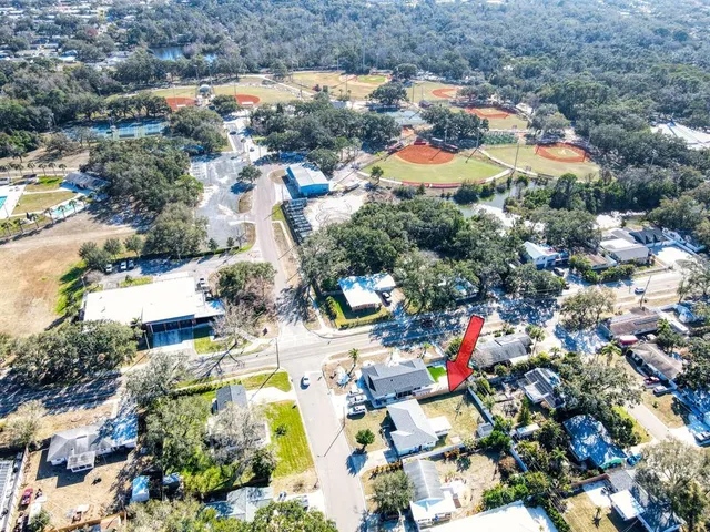 an aerial view of residential houses with outdoor space