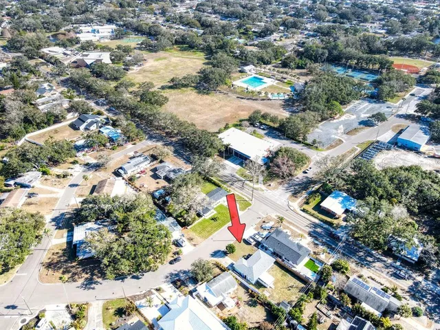an aerial view of residential houses with outdoor space