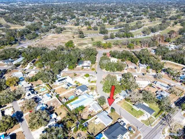 an aerial view of residential houses with outdoor space