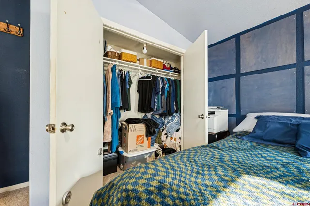 a living room with furniture flowerpot and a chandelier