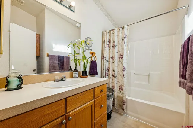 a bathroom with a bathtub and shower