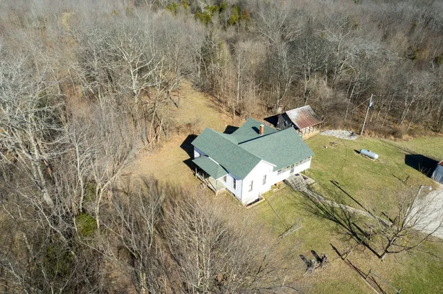 a view of a backyard of the house