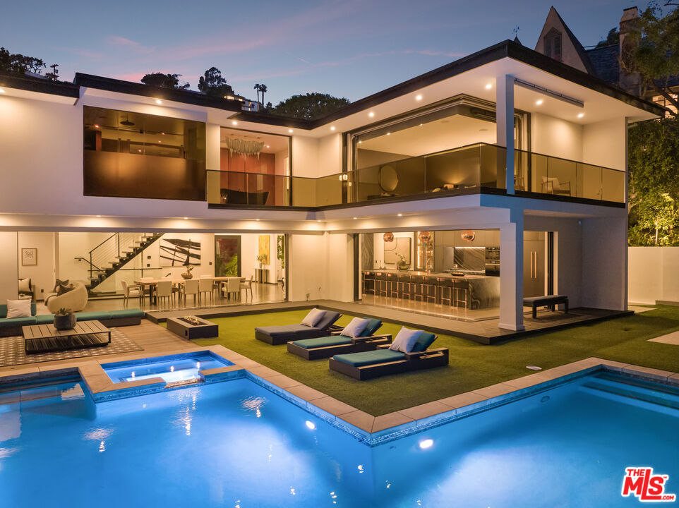 a room with gym equipment and pool table