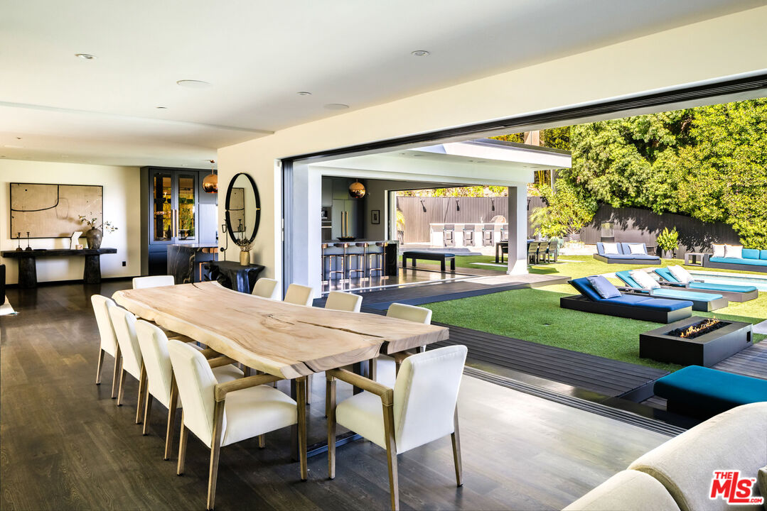 1516 North Kings Road Los Angeles, CA 90069 - Photo 11 of 45 a dining room with furniture and a large window