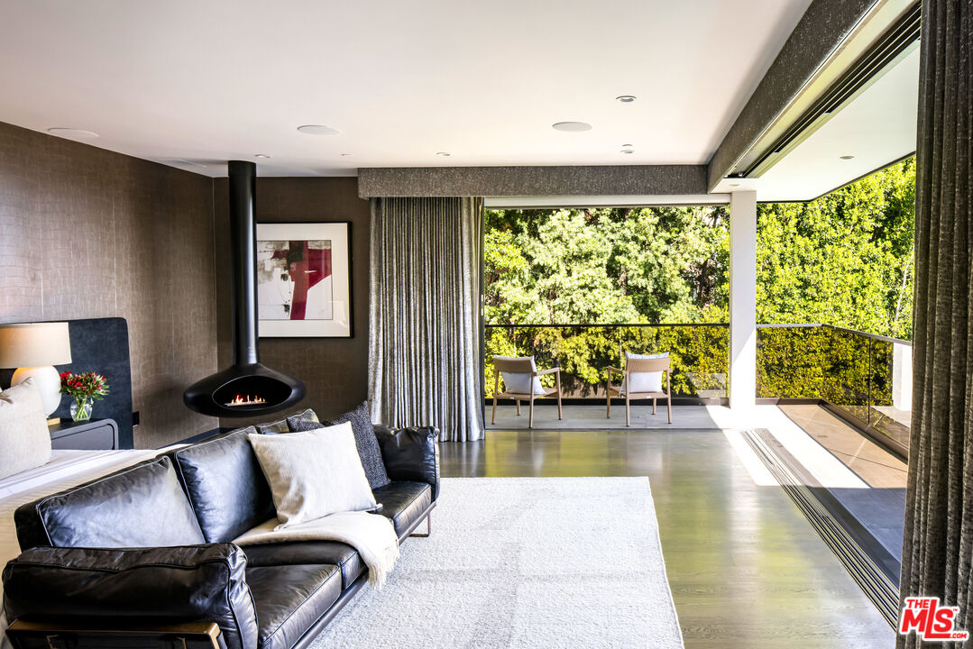 1516 North Kings Road Los Angeles, CA 90069 - Photo 14 of 45 a living room with furniture and a floor to ceiling window