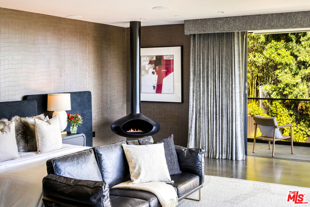 1516 North Kings Road Los Angeles, CA 90069 - Photo 15 of 45 a living room with furniture and a floor to ceiling window