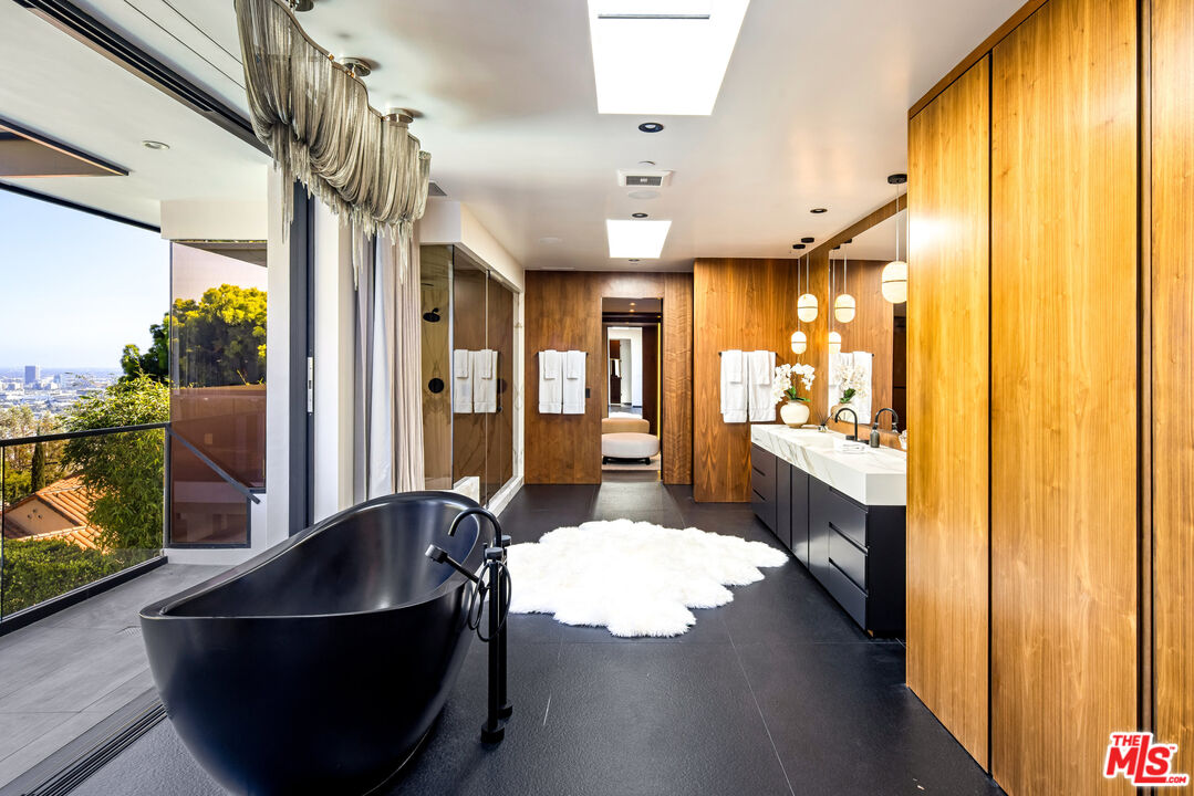 1516 North Kings Road Los Angeles, CA 90069 - Photo 18 of 45 a living room with furniture and a flat screen tv