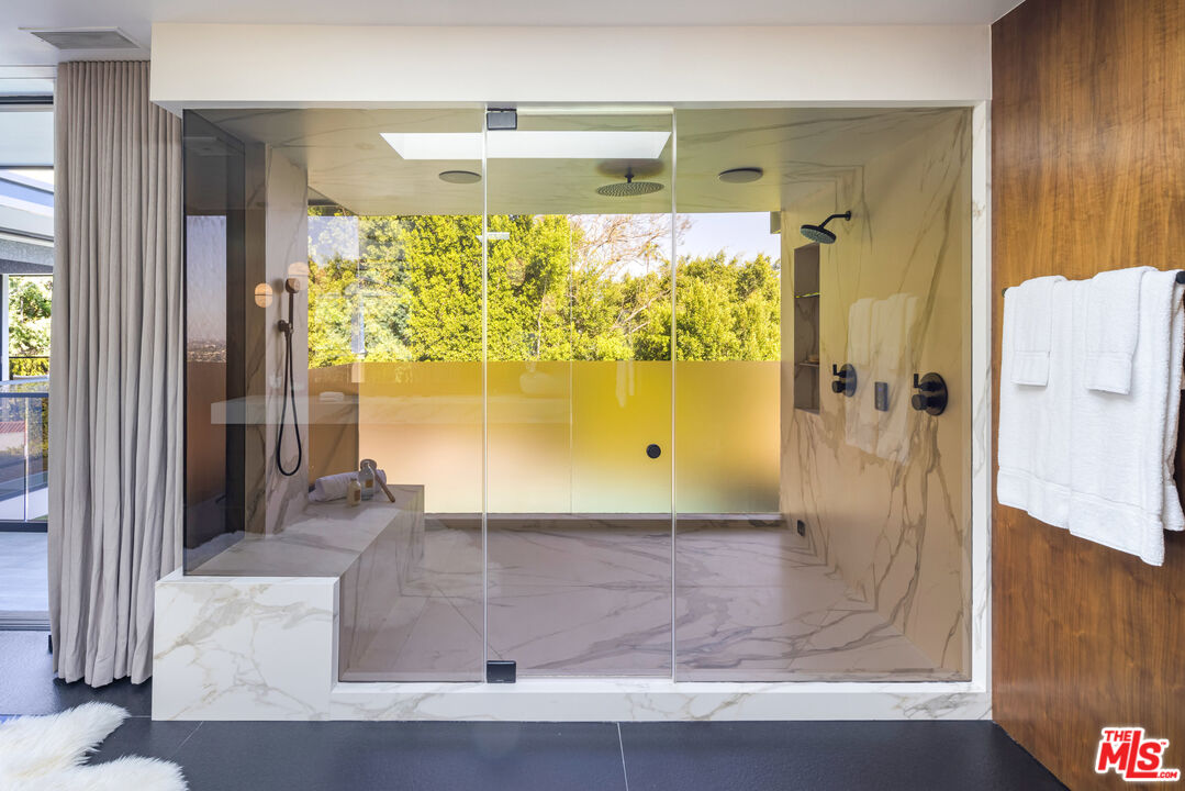 1516 North Kings Road Los Angeles, CA 90069 - Photo 19 of 45 a bathroom with a glass shower door