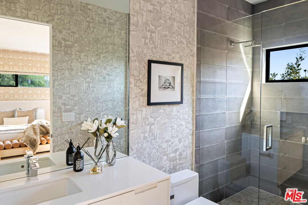 1516 North Kings Road Los Angeles, CA 90069 - Photo 24 of 45 a bathroom with a sink a toilet and shower