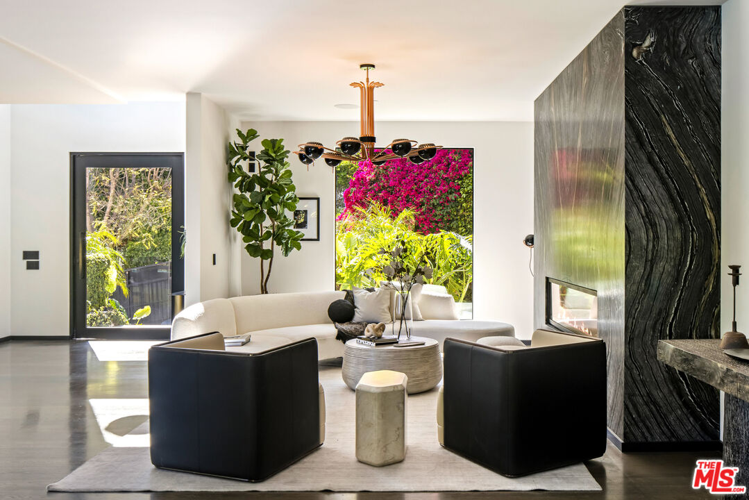1516 North Kings Road Los Angeles, CA 90069 - Photo 3 of 45 a living room with furniture and a potted plant