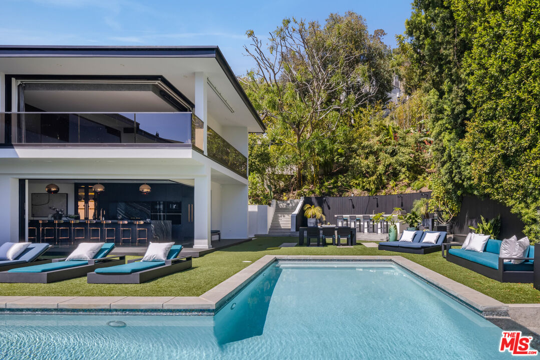 1516 North Kings Road Los Angeles, CA 90069 - Photo 32 of 45 a view of swimming pool with outdoor seating and a yard