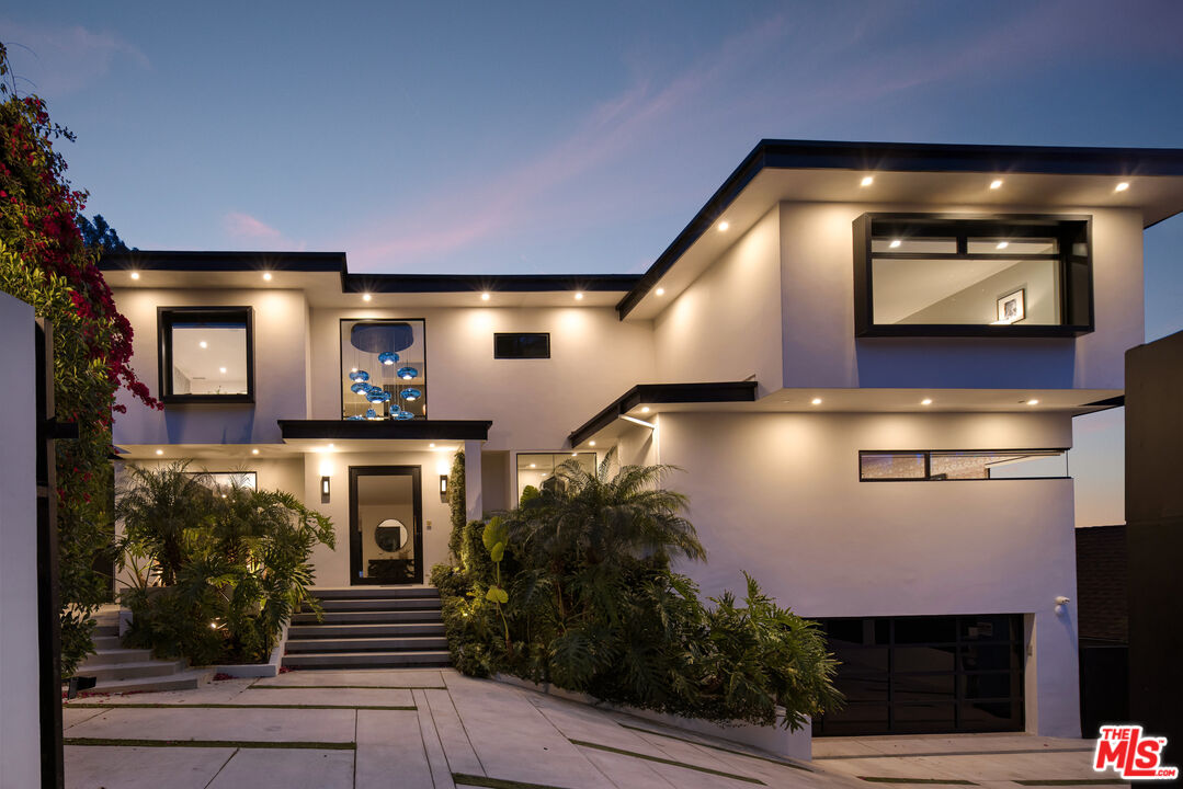 1516 North Kings Road Los Angeles, CA 90069 - Photo 35 of 45 a front view of a house with entryway