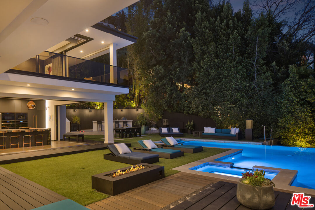 1516 North Kings Road Los Angeles, CA 90069 - Photo 37 of 45 a view of a house with swimming pool and sitting area