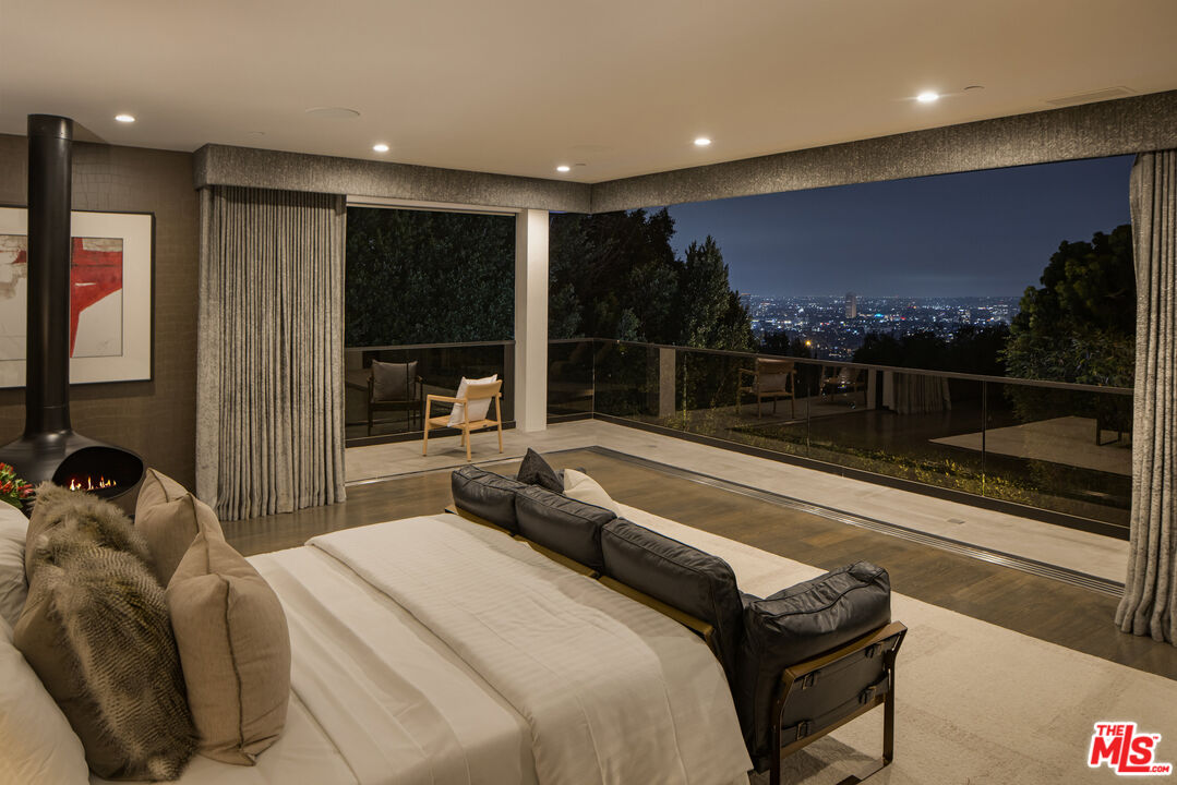 1516 North Kings Road Los Angeles, CA 90069 - Photo 41 of 45 a bedroom with a bed and large window