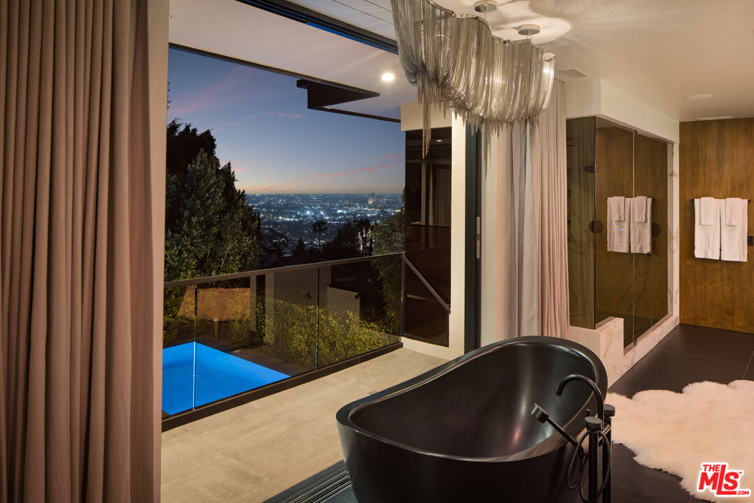 1516 North Kings Road Los Angeles, CA 90069 - Photo 42 of 45 a bathroom with a tub and a sink