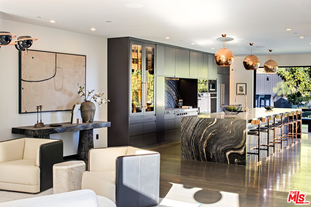 1516 North Kings Road Los Angeles, CA 90069 - Photo 5 of 45 a living room with furniture a flat screen tv and a large window