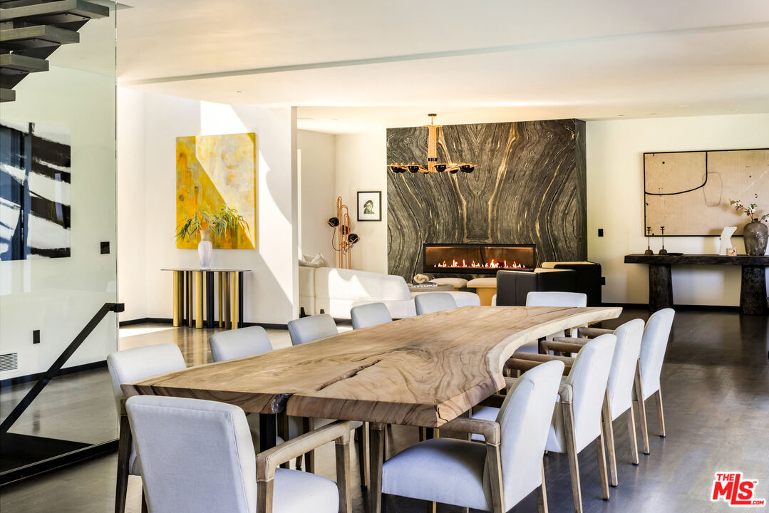 1516 North Kings Road Los Angeles, CA 90069 - Photo 9 of 45 a view of a dining room with furniture and wooden floor