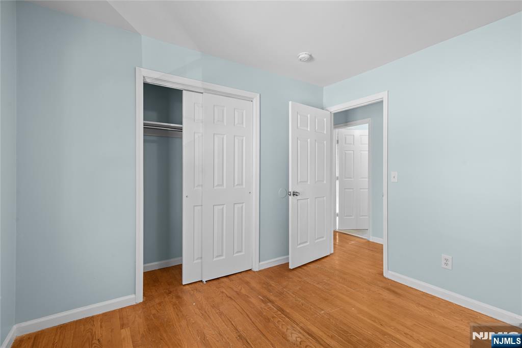 219-221 Clinton Place Newark, NJ 07112 - Photo 13 of 21 a view of empty room with wooden floor