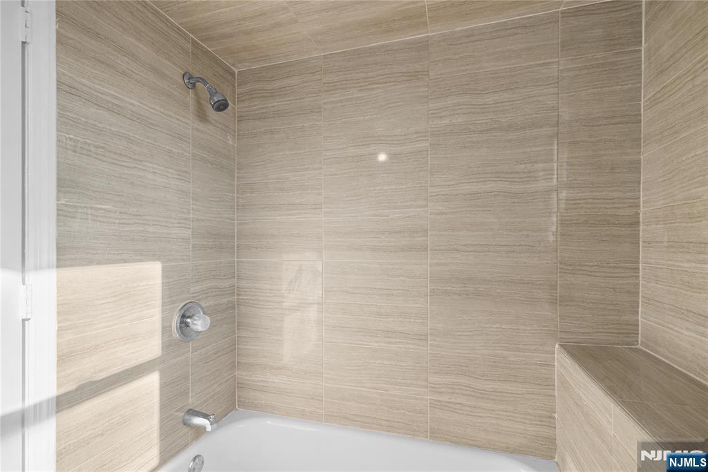 219-221 Clinton Place Newark, NJ 07112 - Photo 16 of 21 a bathroom with a shower