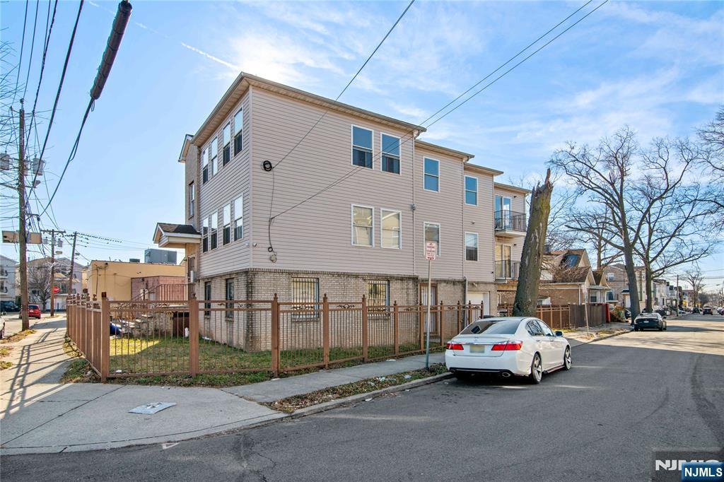 219-221 Clinton Place Newark, NJ 07112 - Photo 20 of 21 a car parked in front of a building