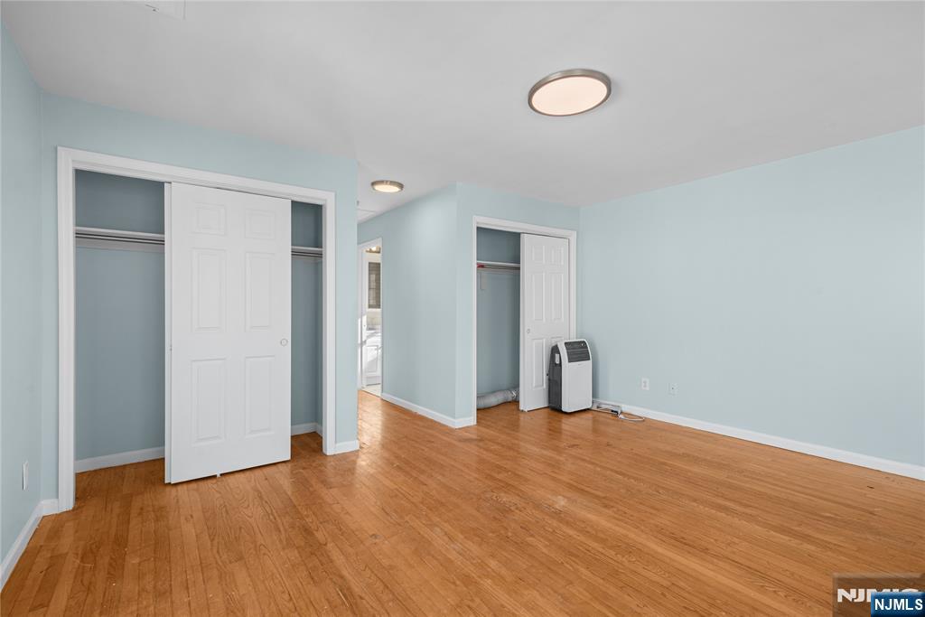 219-221 Clinton Place Newark, NJ 07112 - Photo 10 of 21 a view of empty room with wooden floor