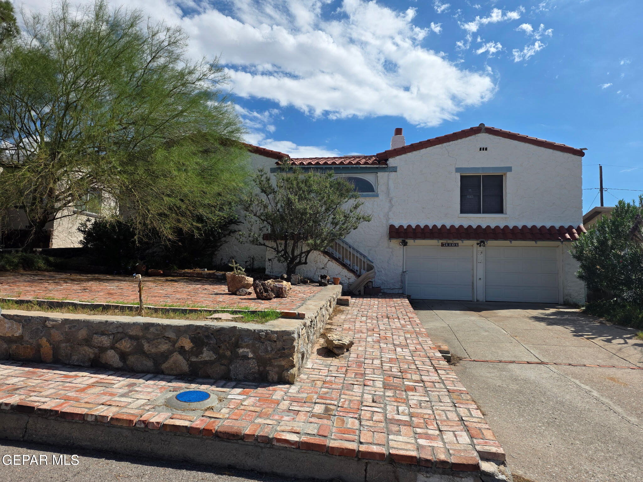 a view of a house with swimming pool and sitting area