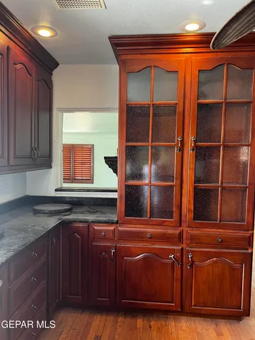 a kitchen with stainless steel appliances granite countertop a sink and a microwave