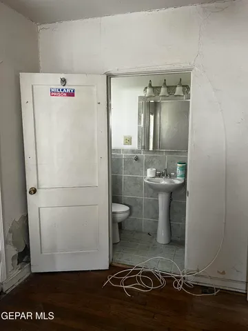 a bathroom with a toilet and a sink