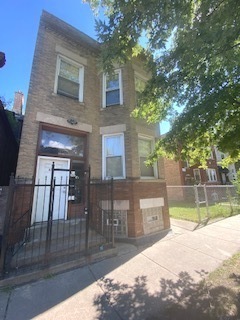6507 South Rhodes Avenue Chicago, IL 60637 - Photo 1 of 9 a view of house with a yard