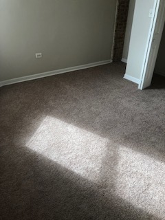 6507 South Rhodes Avenue Chicago, IL 60637 - Photo 7 of 9 a view of room and hallway